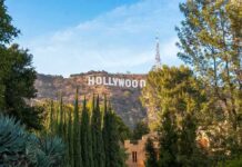 Liberal Star Flips – Endorses Republicans! Hollywood Sign on hillside framed by trees