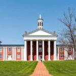 Neoclassical red-brick college building with white columns and cupola