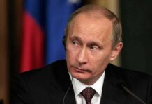 The LARGEST Strike on Moscow, Russian Capital in FLAMES man in suit with earpiece at a conference