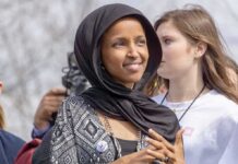 Omar’s Answer to If She Married Her Brother Is Jaw-Dropping Ilhan Omar wearing a black headscarf at an outdoor event