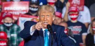 NBA Icon Spotted at Raucous Trump Rally speaker pointing during a rally