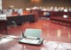 Conference microphone on a desk in a courtroom