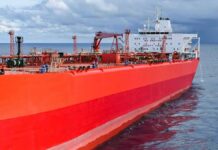 Red oil tanker ship at sea