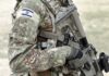 Israel Stunt Backfires – Candidate Detained soldier in camouflage holding a rifle