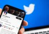 Smartphone displaying a social media profile on Twitter app