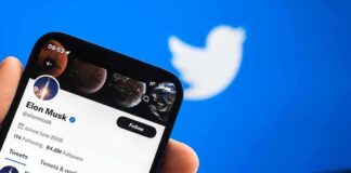 Musk Promises Share For Every Kid Smartphone displaying a social media profile on Twitter app