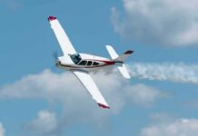 Single-engine airplane banking in a clear sky