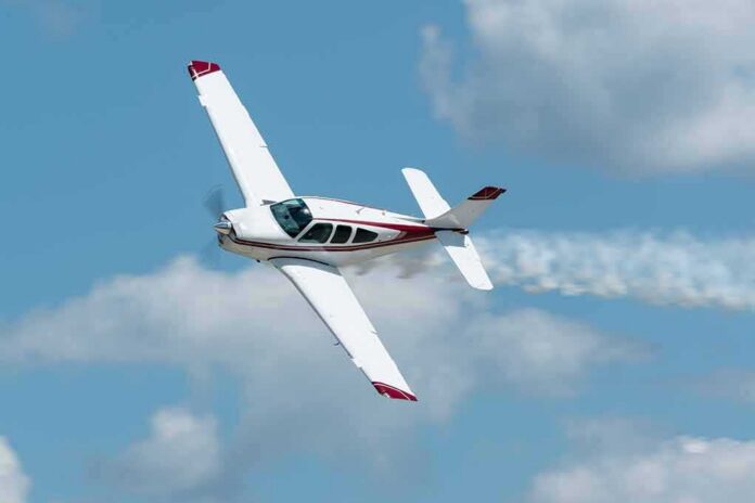 Single-engine airplane banking in a clear sky