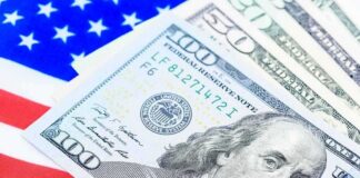 us dollar bills on american flag background
