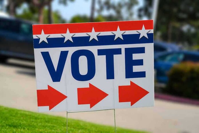 Election sign with the word VOTE and red arrows
