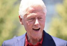 Frail Looking Clinton Surfaces on Campaign Trail Bill Clinton smiling outdoors in a blue blazer and red shirt