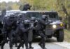Berlin Braces For Russian Attack – Sets Up Border Defense Tactical police team advances from armored vehicle with shields and rifles