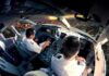 Bleeding Pilot Reveals How He Outsmarted Hijacker Mid-Flight Pilots in an airplane cockpit during city approach at sunset