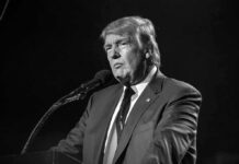 Miss Switzerland Accuses Trump of Rape – Shock Allegation Donald Trump speaking at a microphone in a black-and-white photo