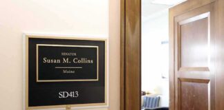 Dem Candidate CHOKES In Senate Debate Office door sign in a hallway