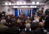 Trump Bares Teeth At Reporter – Oval Office Stunned! Press secretary at podium addressing reporters in briefing room